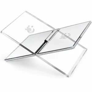 Baileyn clear folding acrylic book stand with engraved motifs on a white background