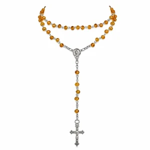 Waama Jewels amber beaded rosary with a silver-tone crucifix on a white background