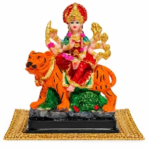 BERRYCRAVE Durga idol seated on a tiger over a velvet aasan on a white background
