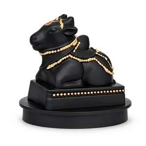 Sanskaari black Nandi figurine with gold-tone ornaments on a white background