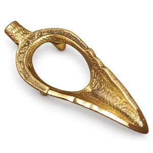 Empty brass Shankh holder stand with oval opening on white background