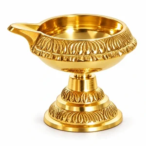 Brass Kuber diya with raised pedestal and leaf-pattern base on white