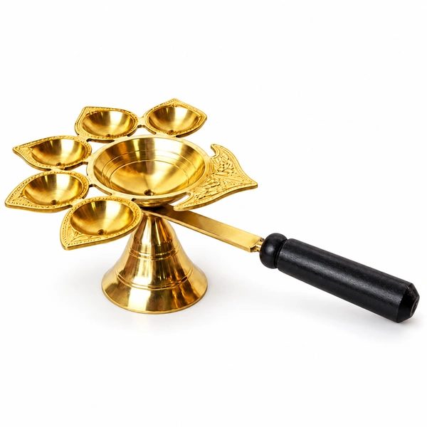 Five-wick brass aarti diya with black wooden handle on white background