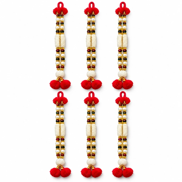 Set of six white artificial-pearl deity malas with gold spacers and red ends