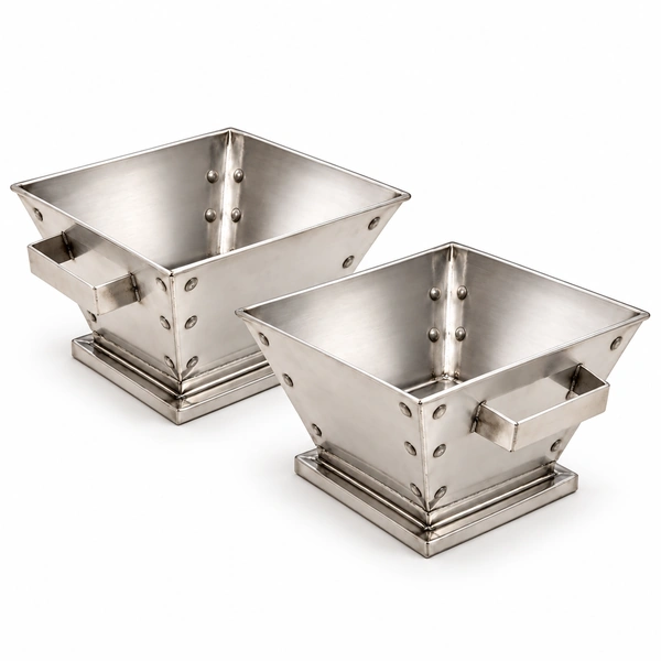 Set of two small empty silver-colour metal havan kunds with riveted corners