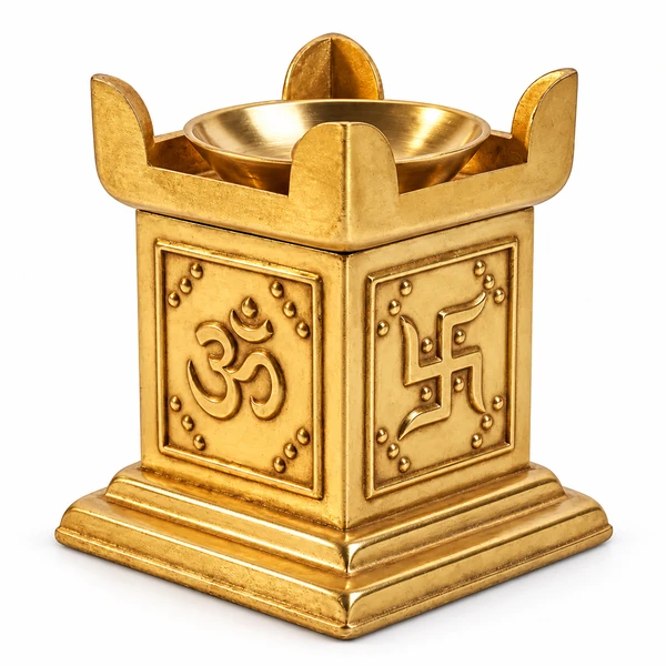 Brass Om havan kund style diya with raised panels and a round bowl on white