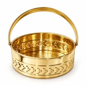 Empty round brass puja basket with arched handle and pierced decorative side band on white