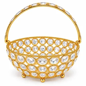 Empty gold-tone puja basket with clear oval accents, arched handle and small round feet on white