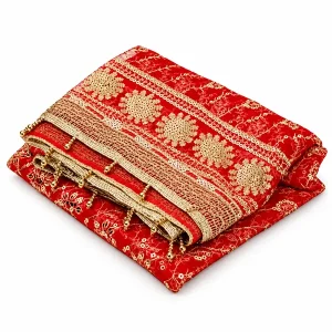 Folded red Mata Rani chunri with gold floral medallion border and decorative trim on white