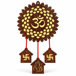 Large brown wooden Om wall hanging with gold floral mandala, red cords and three house-shaped pendants on white