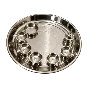 Stainless steel pooja thali set with five diya cups, a bowl and incense holder on a transparent background