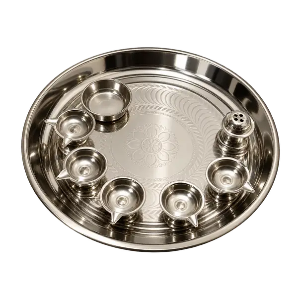 Stainless steel pooja thali set with five diya cups, a bowl and incense holder on a transparent background