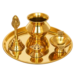 Golden brass pooja set with plate, hand bell, lota, diya and incense holder on a transparent background
