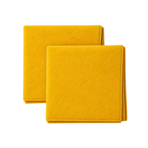 Two folded yellow fabric pooja aasan mats on a transparent background