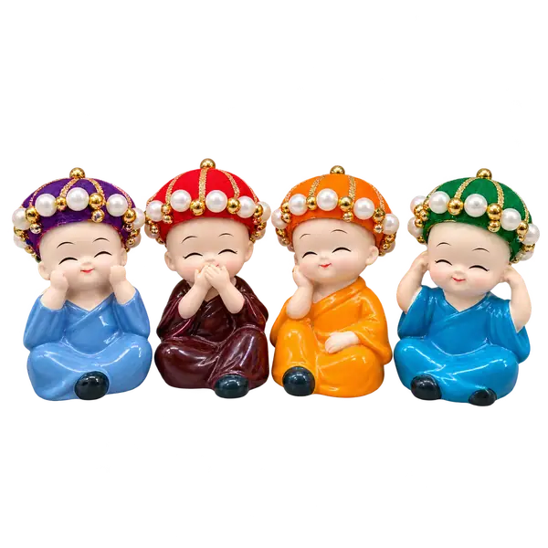 Four colourful hat baby monk resin figurines on a transparent background