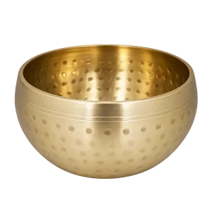 Empty hammered brass singing bowl on a transparent background