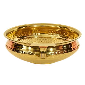Empty hammered gold tone brass urli bowl on a transparent background