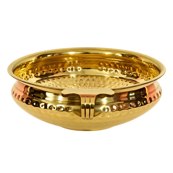 Empty hammered gold tone brass urli bowl on a transparent background