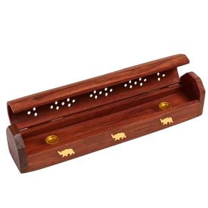 Open brown wooden incense box with brass elephant inlays on a transparent background